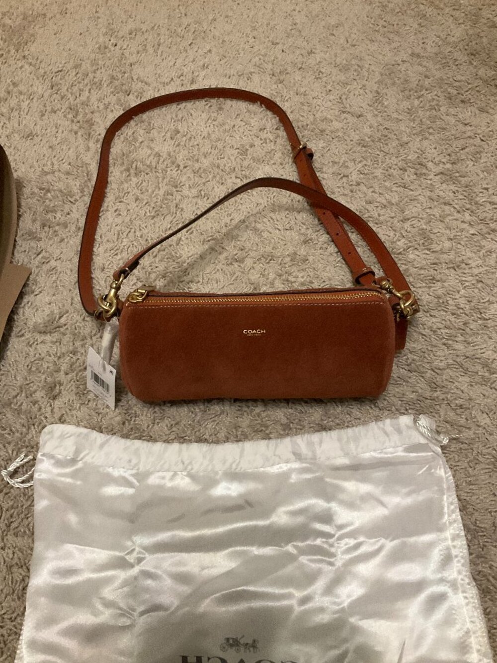 COACH barrel bag. brass/clay. CDy81.